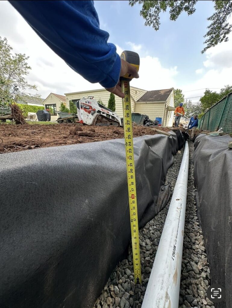 Properly Measuring Drainage System Depth for proper water flow away from the house