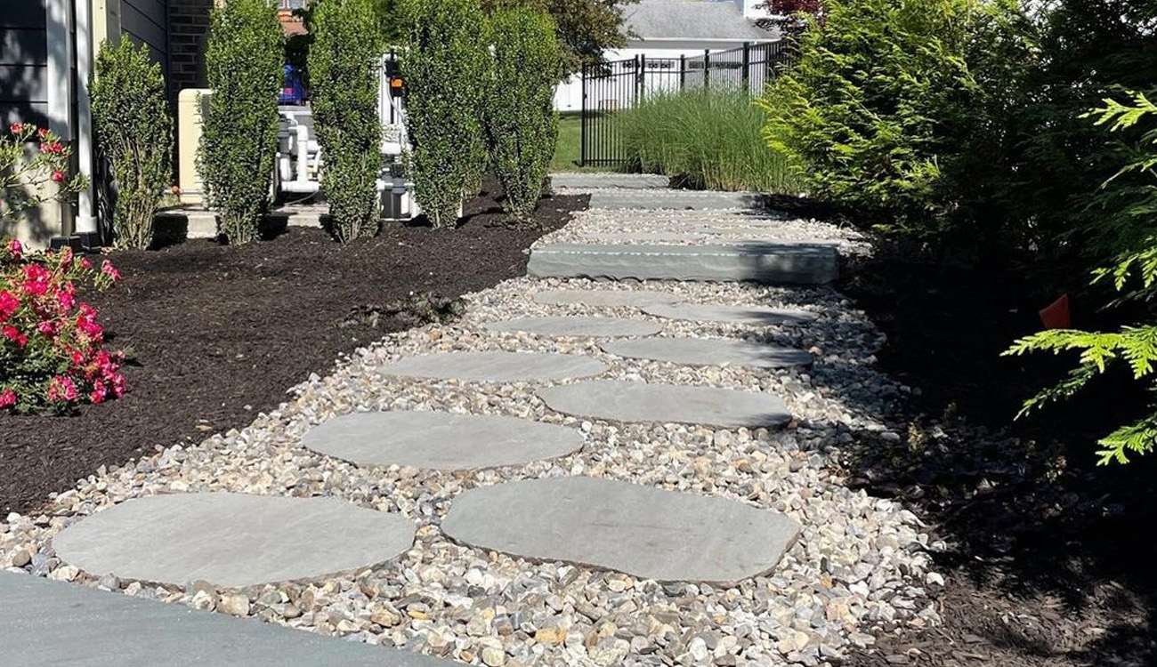Stylish stone walkway with greenery.
